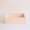 Wooden shelf against a white wall